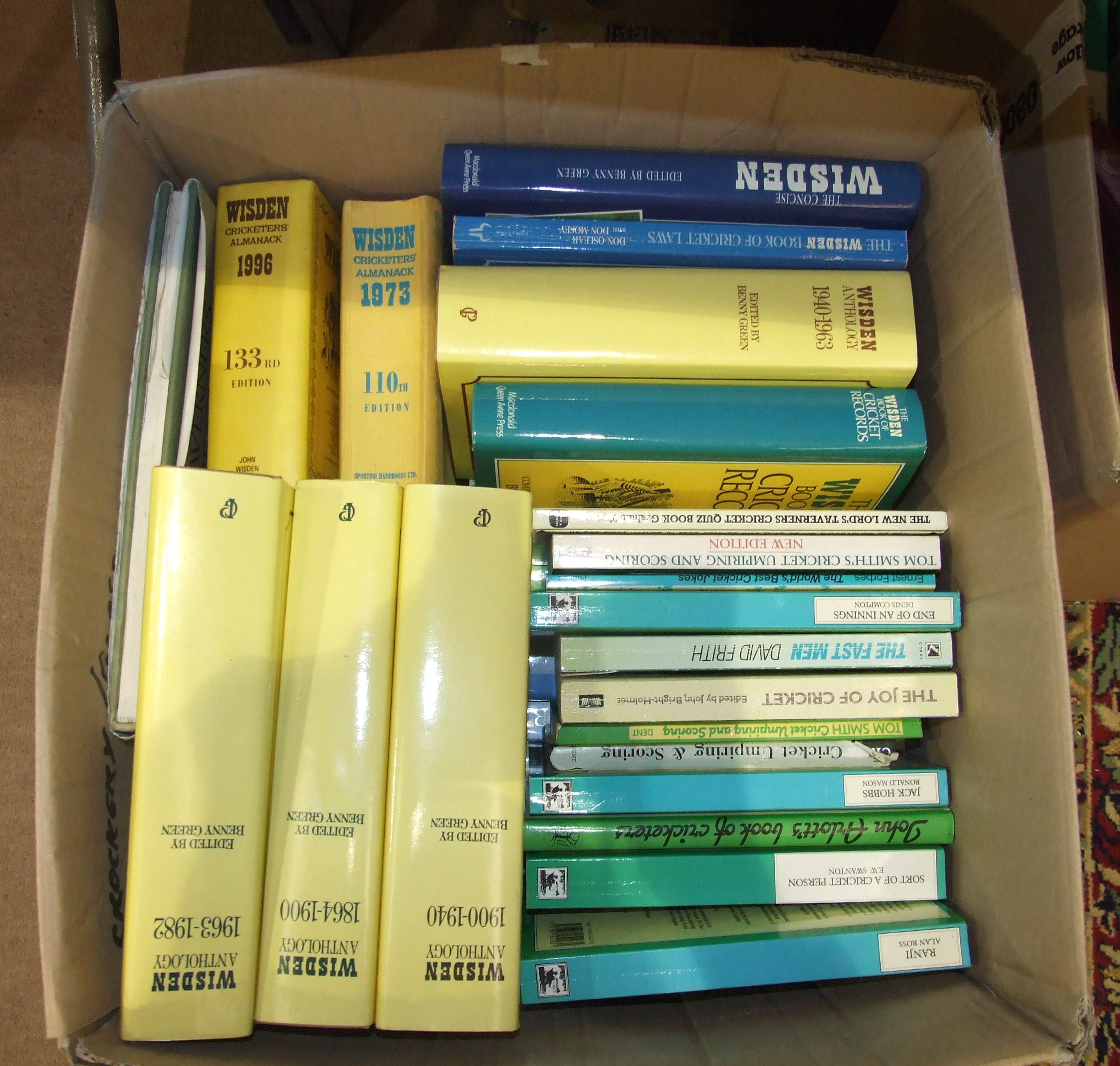 A large collection of books on cricket, the contents of three boxes.