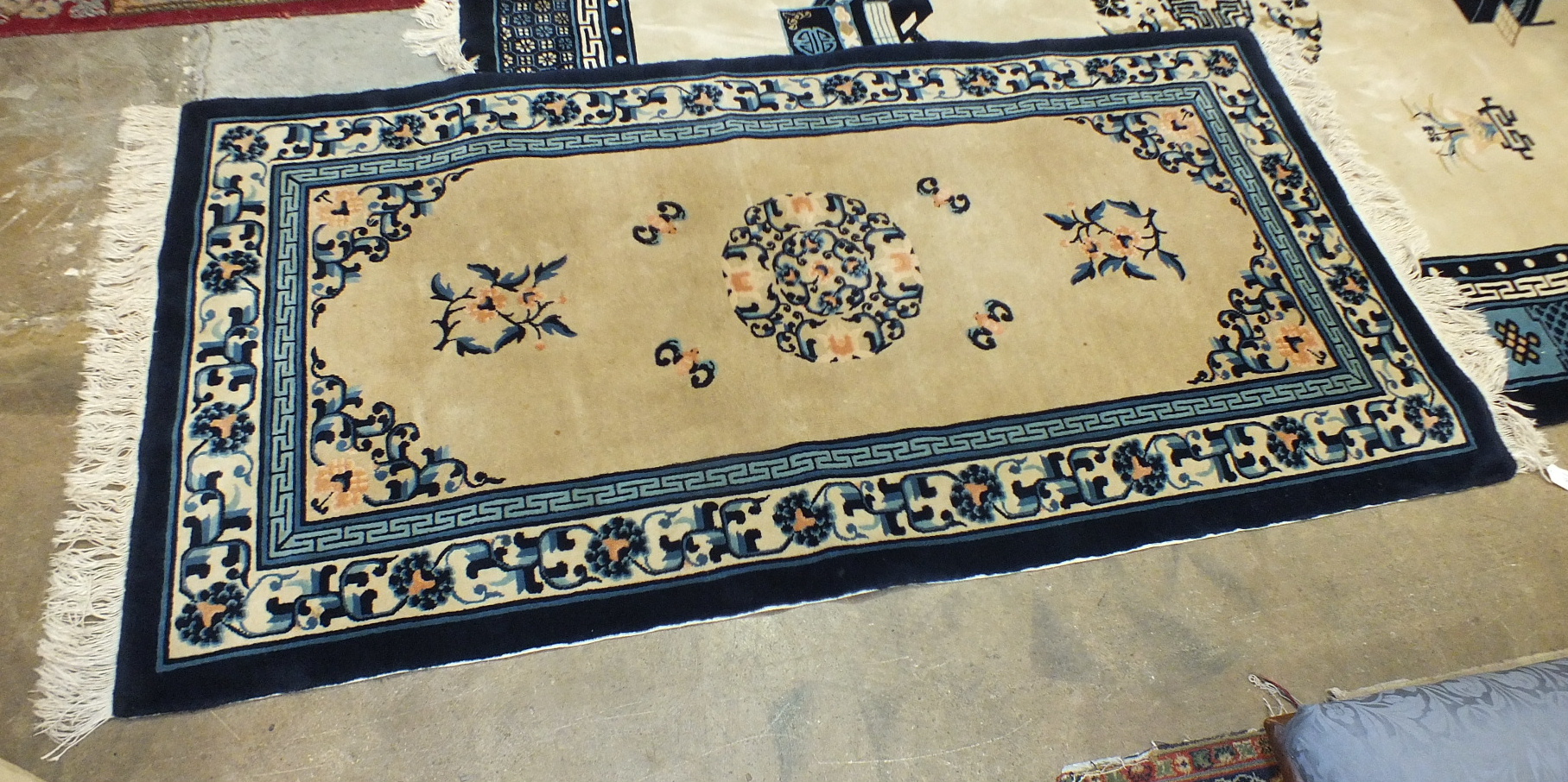 A large modern Chinese rug with deep blue borders on a camel-coloured ground, 279 x 184 and a - Image 2 of 2