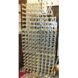 A collection of nine modern galvanised metal and wood wine racks, various sizes.