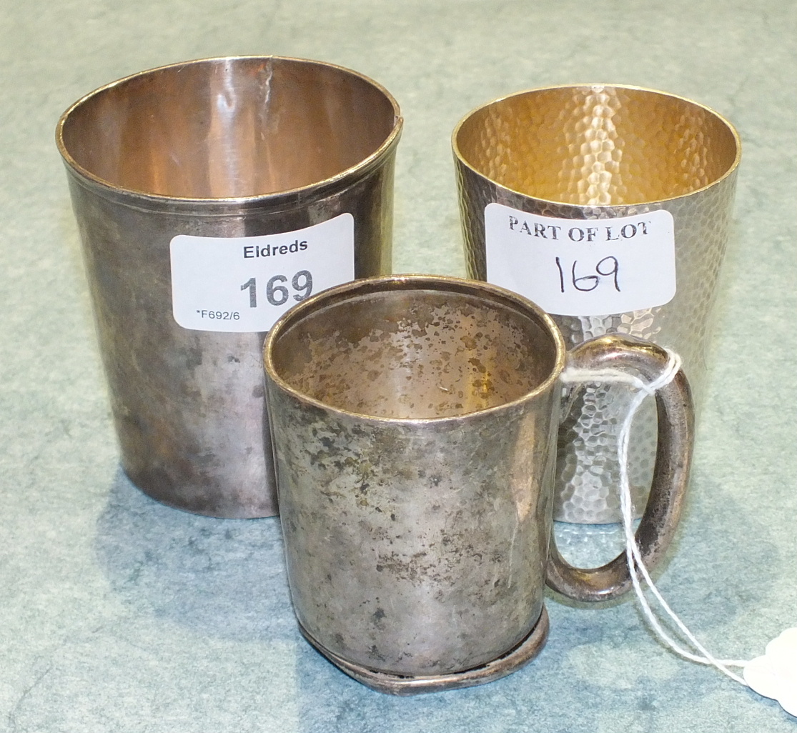 A silver christening mug, 6.2cm high, Sheffield 1937, ___1½oz, (a/f), a white metal beaker, 7.5cm