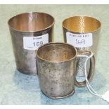 A silver christening mug, 6.2cm high, Sheffield 1937, ___1½oz, (a/f), a white metal beaker, 7.5cm