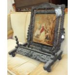A 19th century Continental carved hardwood fire screen with later central moquette panel, (