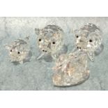 Two Swarovski large crystal pigs, 5cm high, a smaller pig and a swan, all boxed, (4).