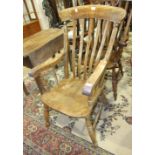 A stained elm and beech lathe-back farmhouse chair on turned legs and H-stretcher, (needs re-