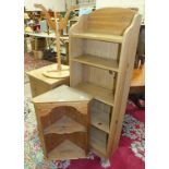 A stained pine bedside cupboard, a set of five-tier narrow pine bookshelves, 45.5cm wide, 131cm