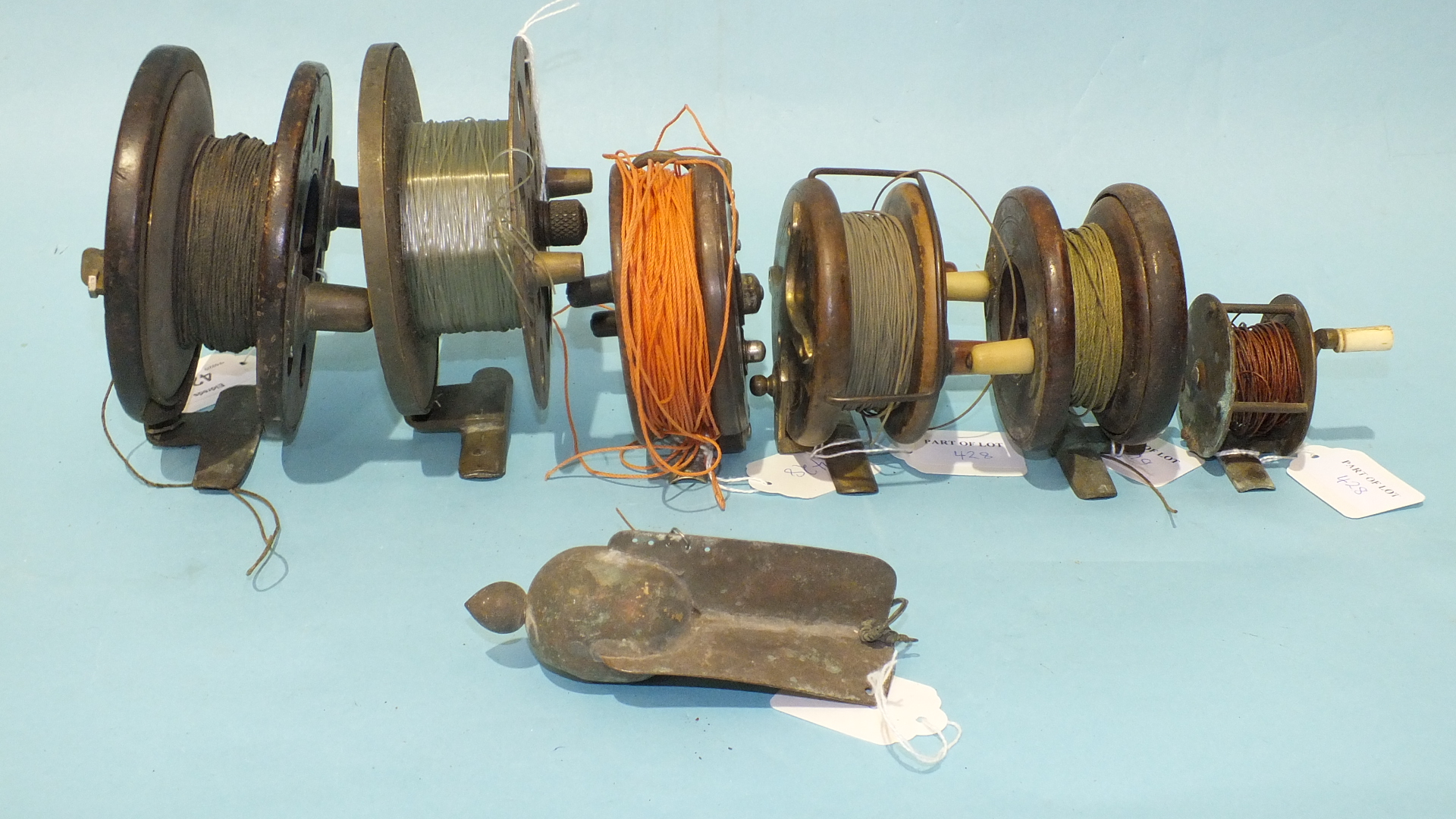 Three 19th century wooden trolling reels, an Alcocks Bakelite reel, a 19th century brass winch and - Image 4 of 4