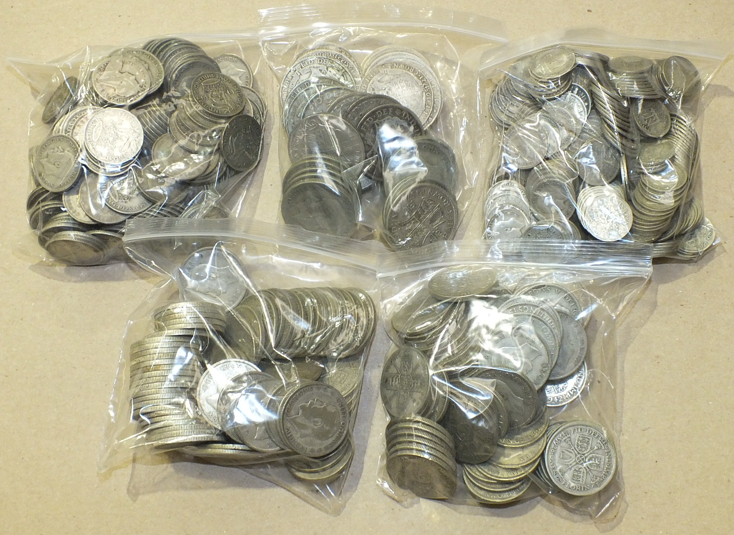 A collection of British .500 silver coins 1920-1946: 44 half-crowns, 142 florins, 155 shillings