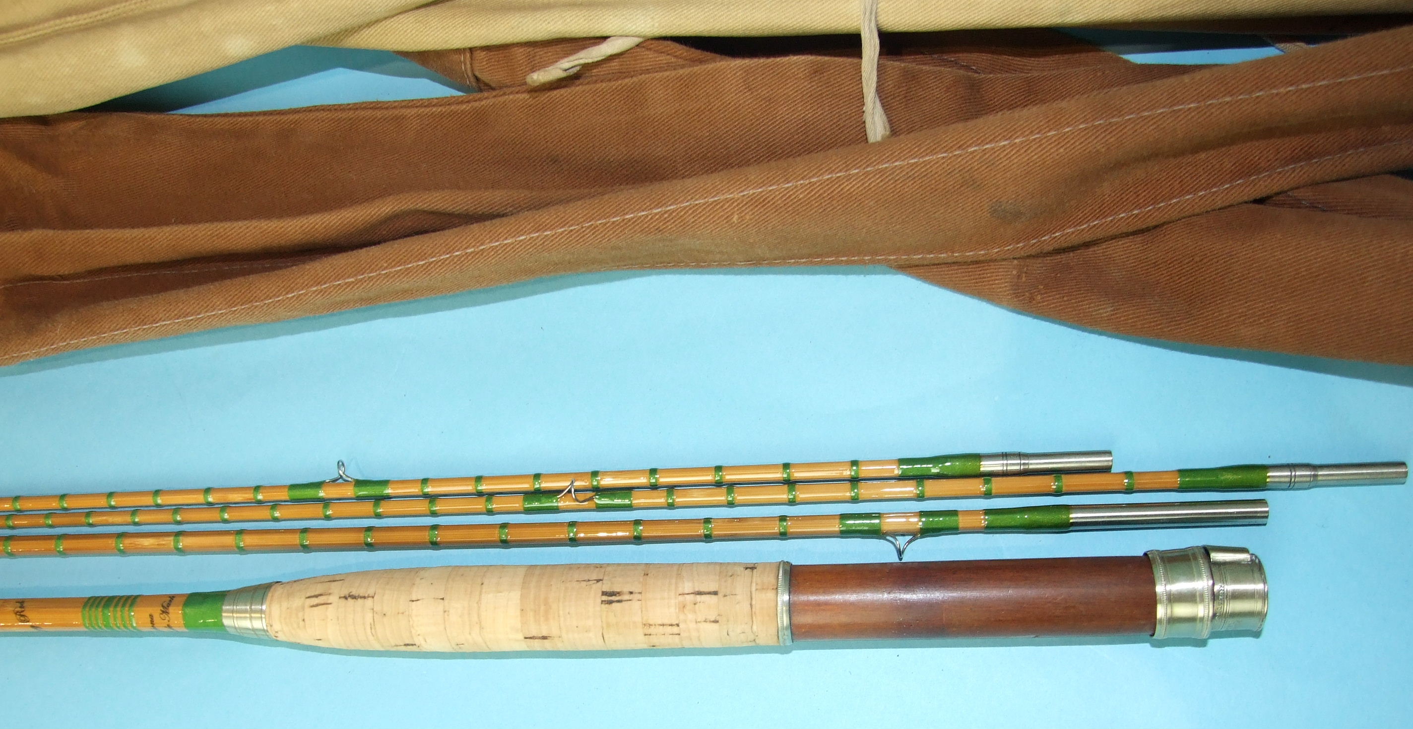 A Hardy's 9' 6" split-cane three-piece fly rod "The Fairy Rod" no.44419, with spare tip, in bag.