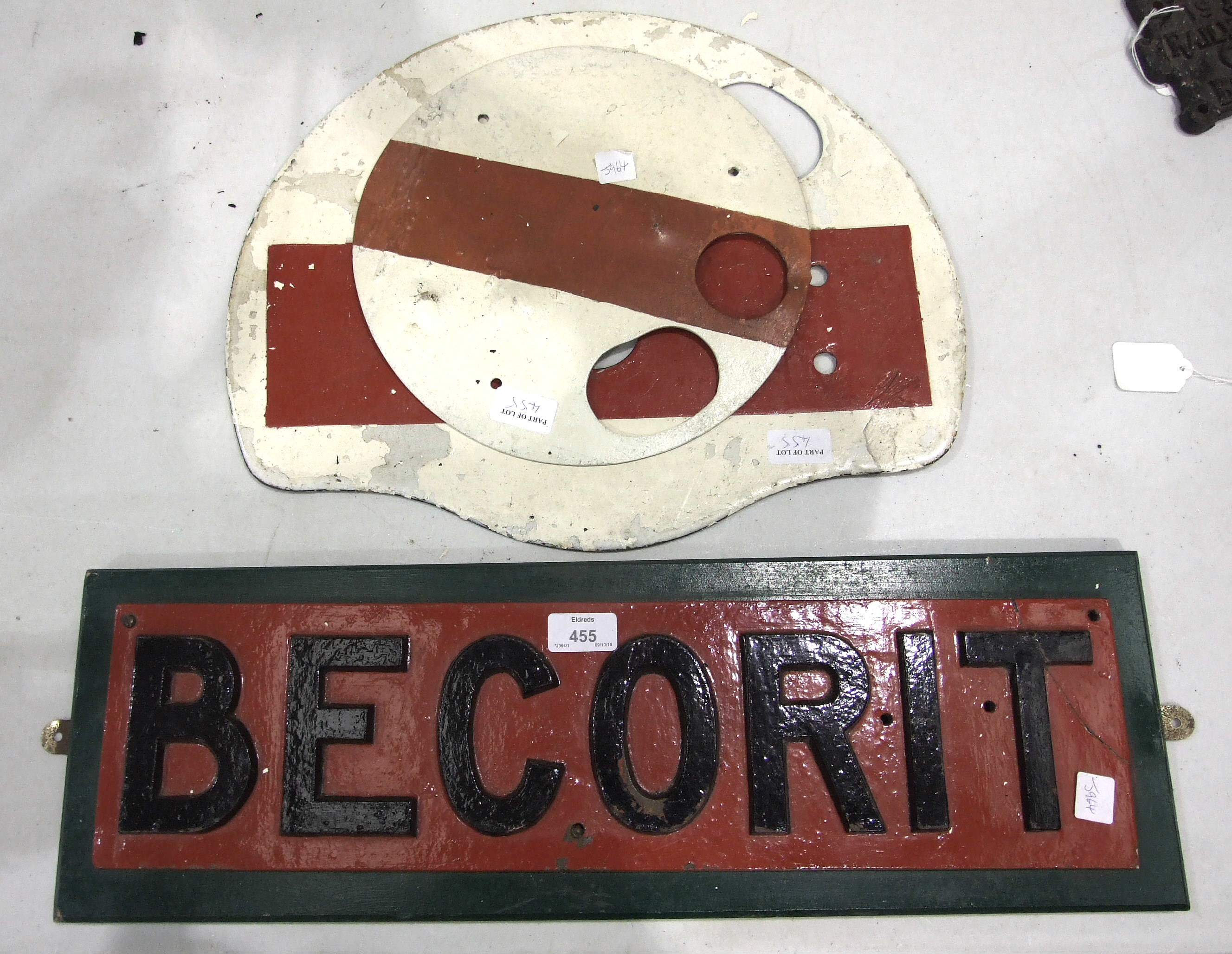 A cast iron locomotive nameplate "Becorit", 56 x 14cm, (corner damaged) and two others, (3).