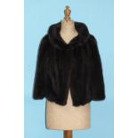 A dark brown mink short jacket, approx size 10, and another blonde mink short jacket, approx size