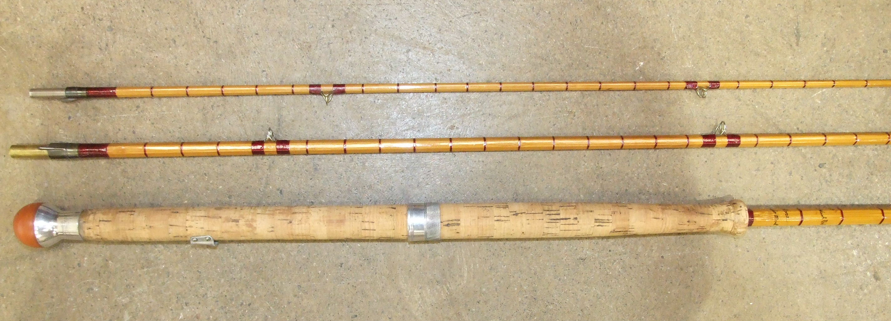 A Hardy's 12' three-piece split-cane rod "The AHE Wood Rod No.3" no. E64458, (restored).