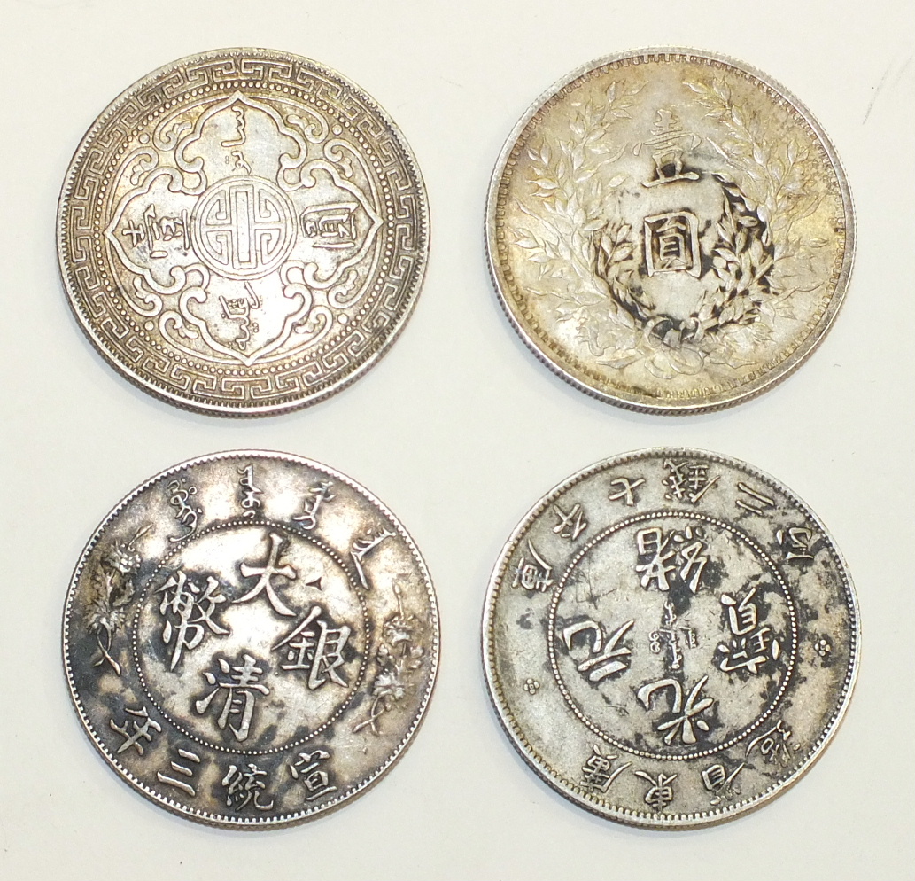 A 1911 China Hong Kong trade dollar, a 1914 Yuan Shih Kai trade dollar, a Kwang Tung Province 7-mace