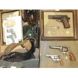 The John Wayne Armed Forces Commemorative .45 Automatic by Franklin Mint, two other replica