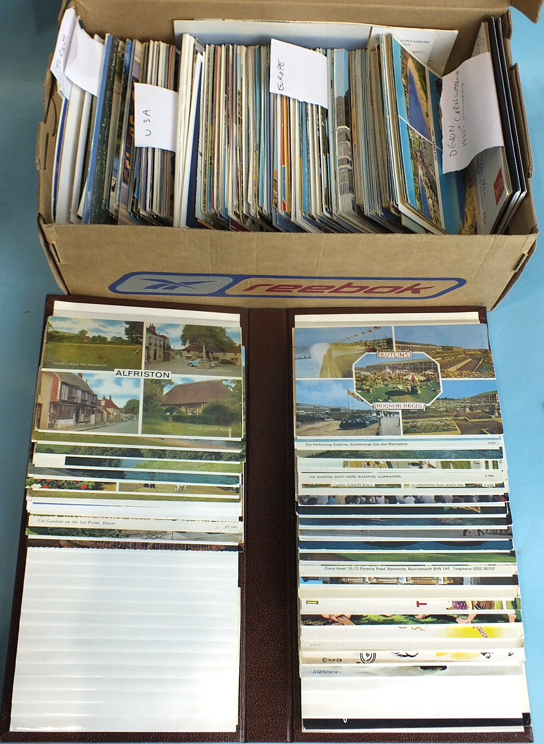 A large quantity of topographical postcards in an album and loose.