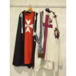 A collection of Masonic regalia including KT and Malta mantles and tunics, leather gloves, belt,