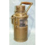 A Bulpitt & Sons brass marine signalling lamp with wood handle and clear bulb eye glass, (