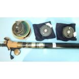 An Orvis Battenkill 7/8 3¼" fly reel in case and two spare spools and an Orvis 9' 3" graphite two-