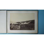 A 19th century album of thirteen photographs of Guadeloupe by E Lamoisse, 11 mounted and titled,