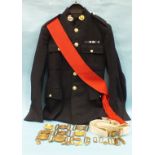 A Royal Marine cap badge and No.1 dress uniform, comprising jacket (size 12), sash and trousers (