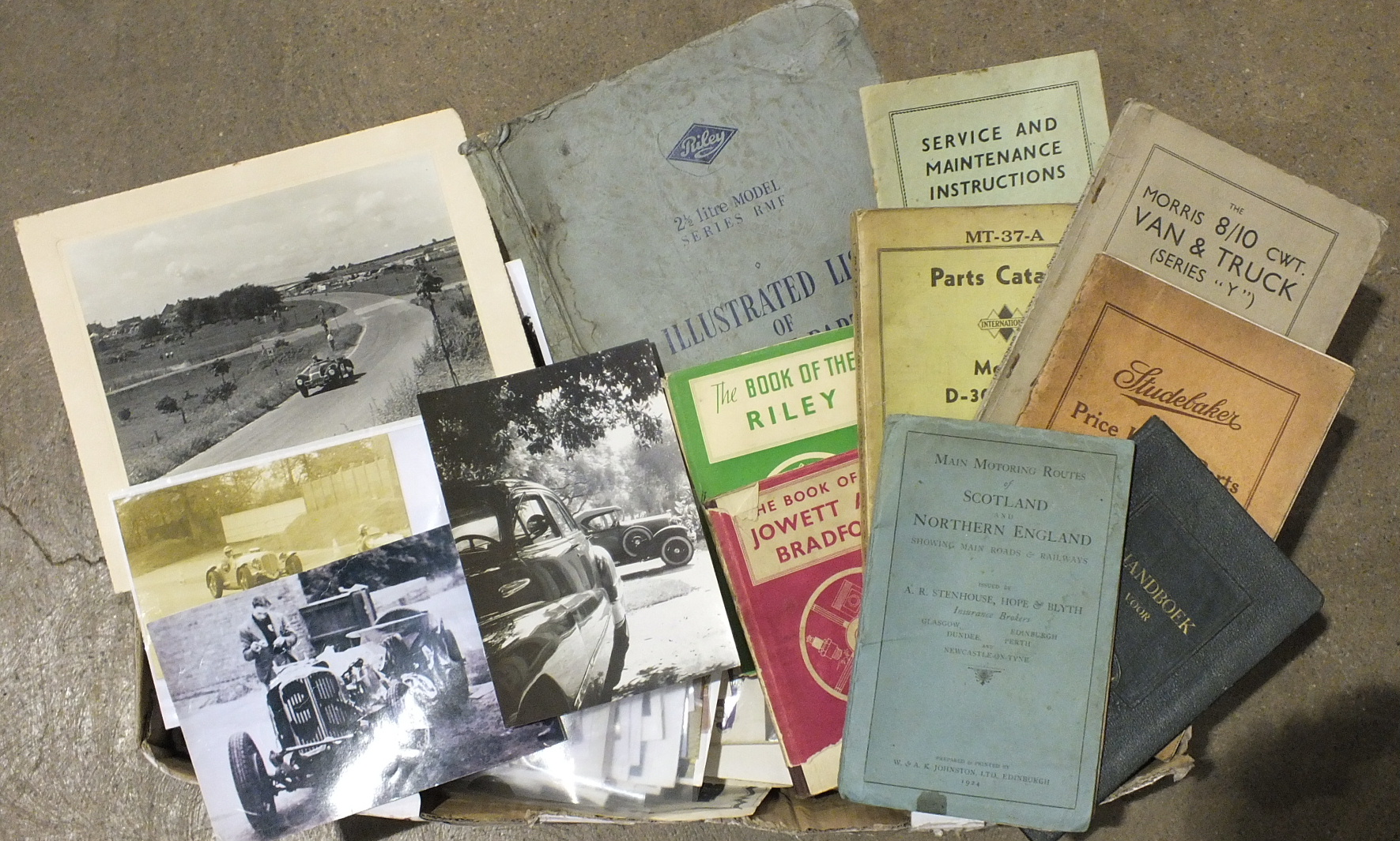 A quantity of motoring ephemera, including photographs, handbooks, manuals, posters, magazines,