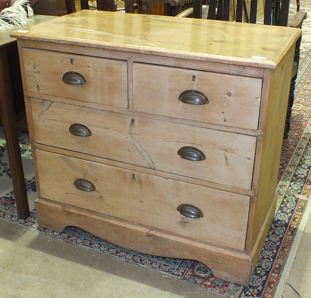 A Victorian stripped pine chest of two short and two long drawers, on bracket feet, 91cm wide.