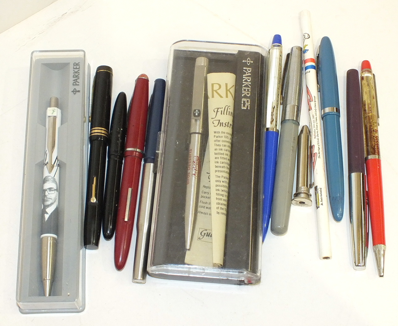 A Conway Stewart 388 black fountain pen, other pens, pencils, badges and miscellaneous items.