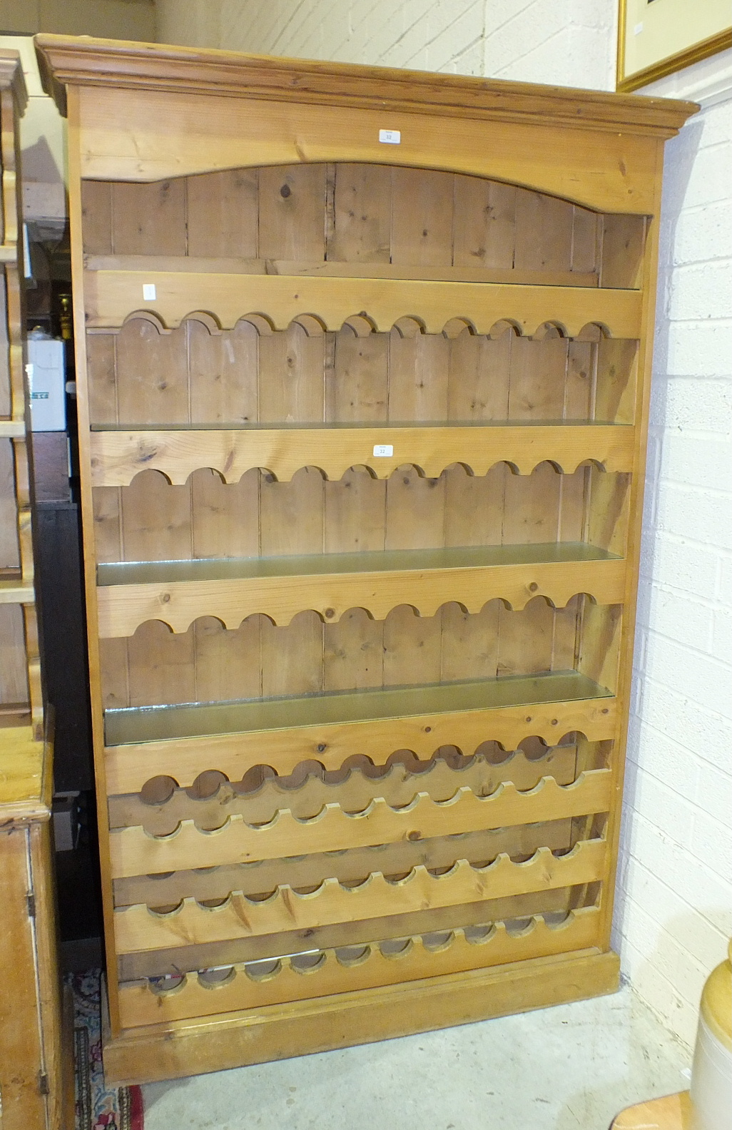 A modern pine wine rack/kitchen shelves, 123cm wide, 201cm high, 28cm deep.