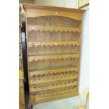 A modern pine wine rack/kitchen shelves, 123cm wide, 201cm high, 28cm deep.