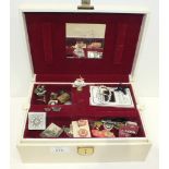 A jewellery box with a quantity of costume jewellery, including some diamanté items.