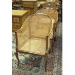 A pair of 20th century caned tub chairs and one other, (3).