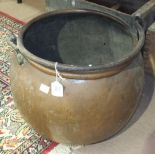 A copper cauldron with iron handle, 36cm high, 36cm diameter.