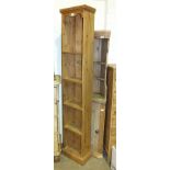 A modern tall slender pine bookshelf, 35cm wide, 183cm high and two small pine hanging corner