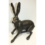 A Frith Sculpture bronzed resin figure of a hare, startled, 50cm high.