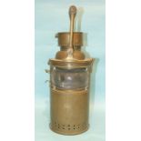 A Bulpitt & Sons brass marine signalling lamp with wood handle and clear bulb eye glass, (