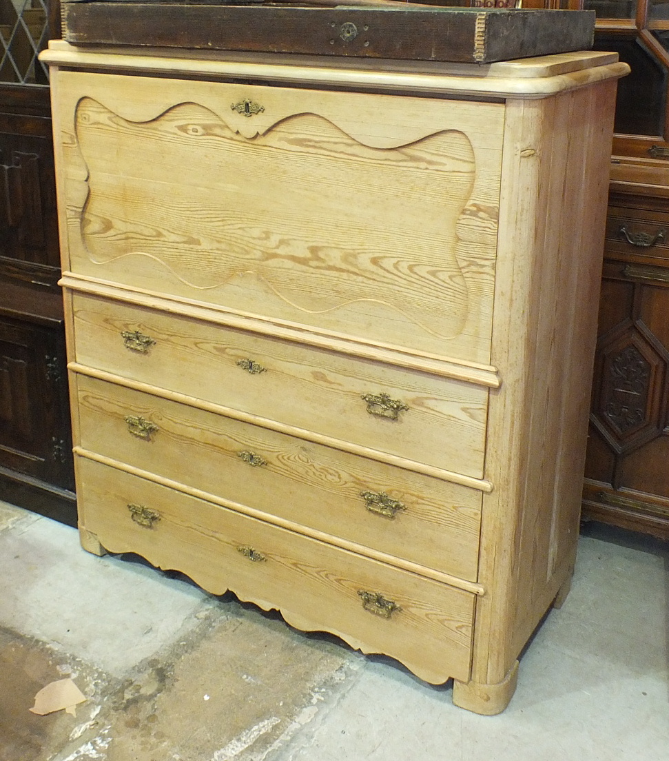 A 19th century Continental pine chest, the upper part with fall front and fitted interior above