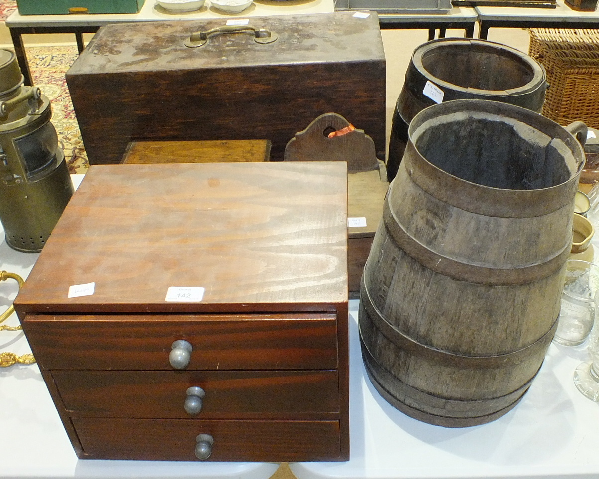 A stained wood tool box, the front opening to reveal eight drawers of varying sizes, with brass