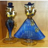 A pair of Murano figures of dancers decorated in blue and amber glass, on circular bases, 30cm high,