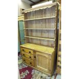 A 19th century pine dresser base fitted with a cupboard door and three drawers, 120cm wide, 79cm