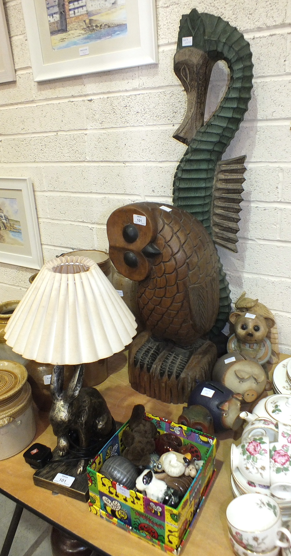 A modern carved wood model of an owl, 51cm high, a carved wooden hare table lamp and other animal