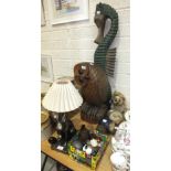 A modern carved wood model of an owl, 51cm high, a carved wooden hare table lamp and other animal