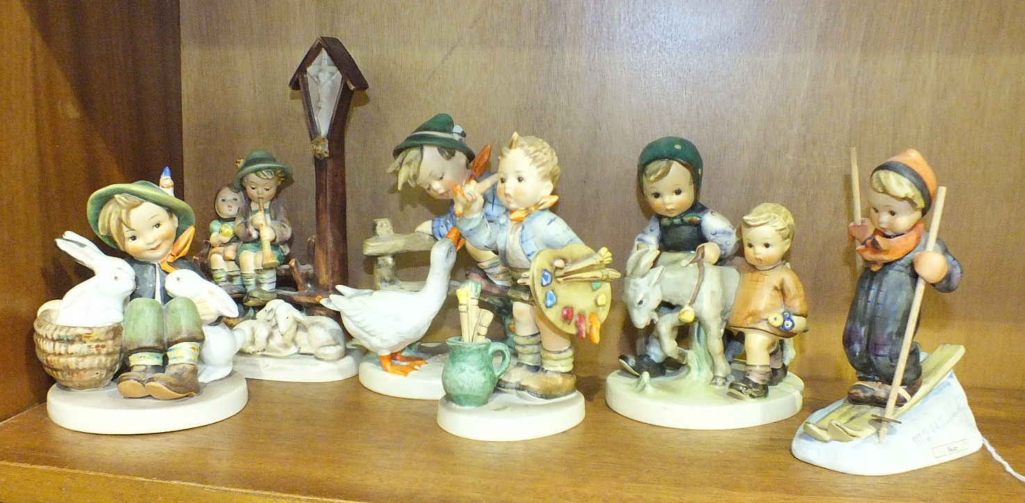 A collection of six Hummel figures: 'Wayside Direction' 18cm high, 'Playmates' 11cm, 'Barnyard Hero'