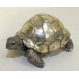 A small modern silver-cased tortoise sculpture, maker 'CA', Birmingham 1993?, 7cm long, 5cm wide.