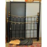 A modern 5ft brass and iron bed.