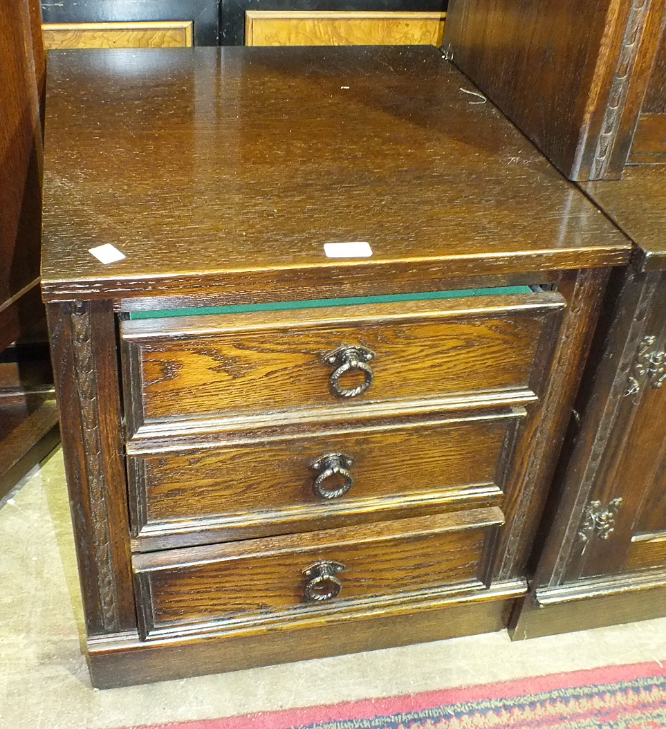 A modern oak low cupboard, the rectangular top above a pair of doors and single drawer, on turned - Image 2 of 2