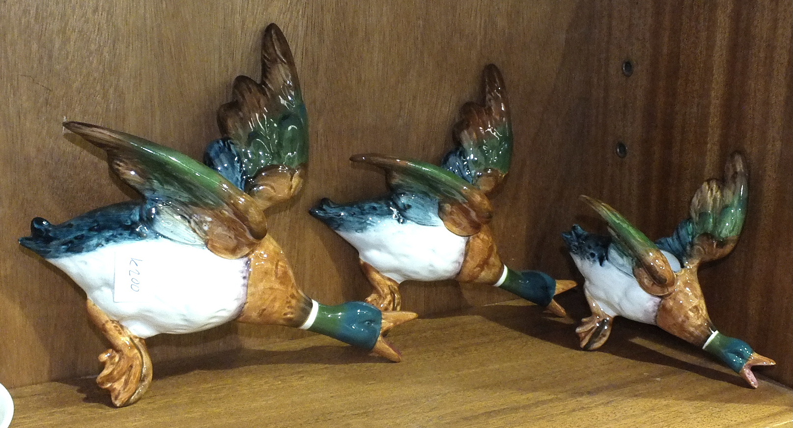 A set of three Beswick flying Mallard wall plaques, no.596-2/3/4 and eight pieces of Wedgwood