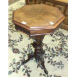 A Victorian walnut octagonal work table with lift lid and fitted interior, on tapered octagonal