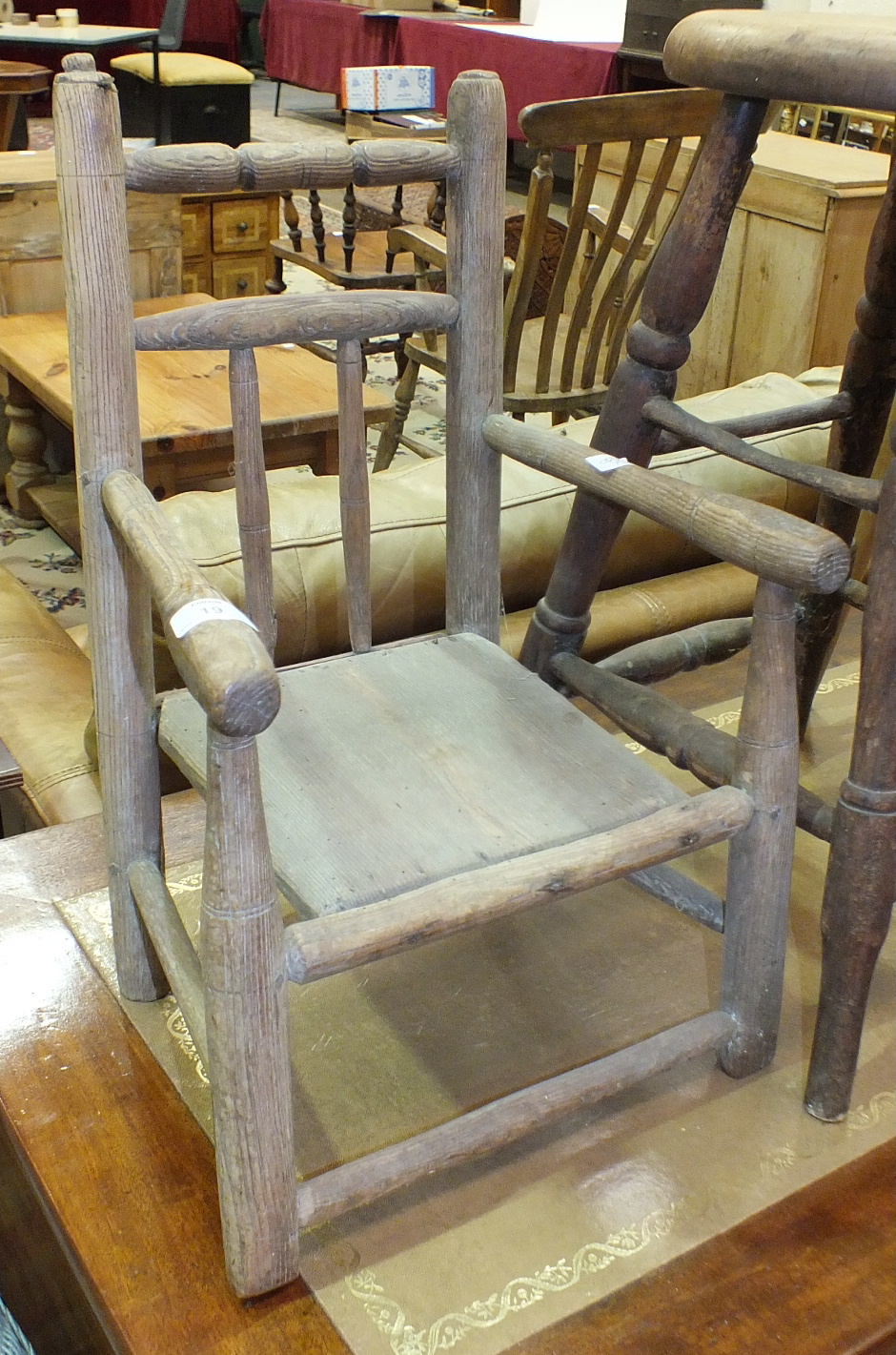 A child's elm armchair, 53cm high, a stripped elm and beech stool and a smaller stained wood