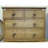 A 19th century small pine chest of two short and two long drawers, 86cm wide, 68cm high.