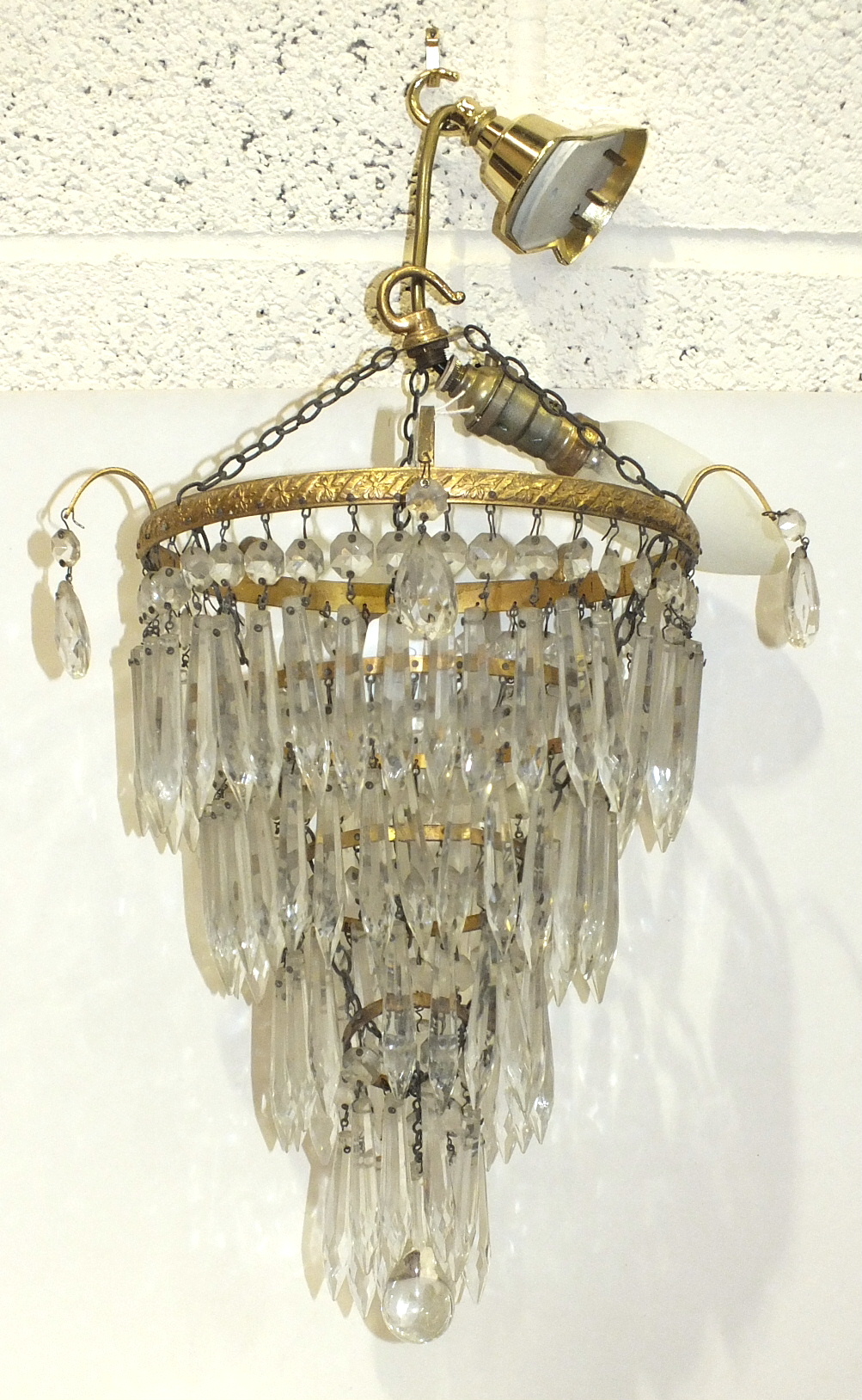 Two modern gilt metal and glass drop four-tier circular hanging chandeliers, 21cm and 24cm diameter,