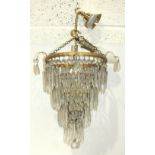 Two modern gilt metal and glass drop four-tier circular hanging chandeliers, 21cm and 24cm diameter,